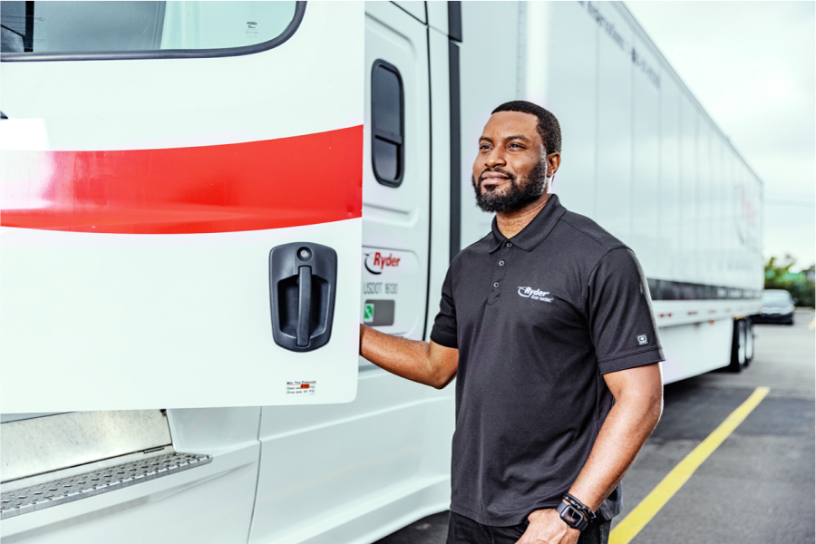 dedicated transportation driver stepping into truck cab