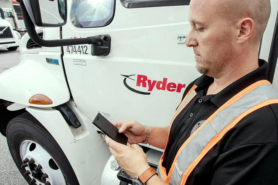 man on phone by truck